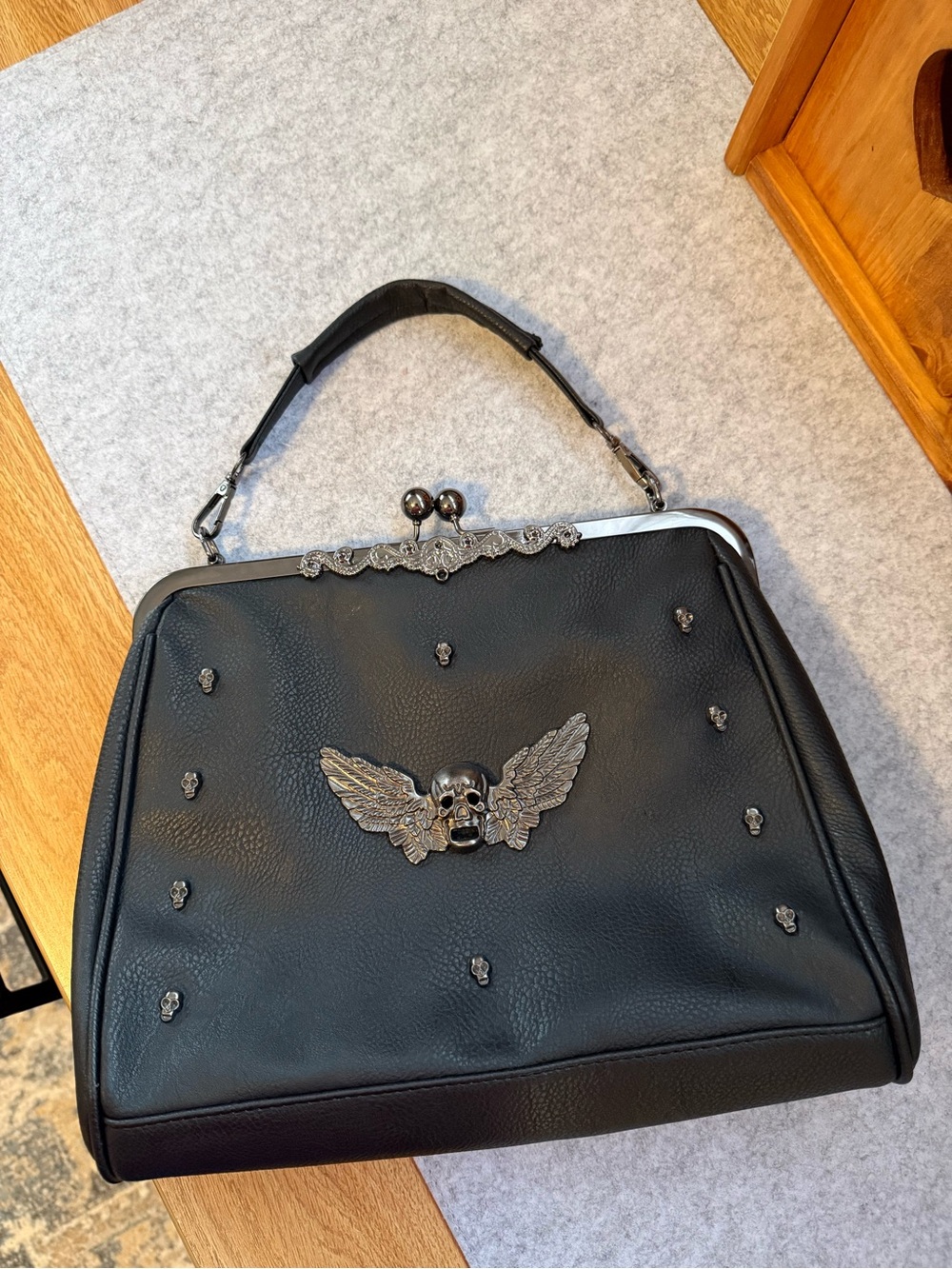 Black Winged Skull Frame Top-Handle Bag
